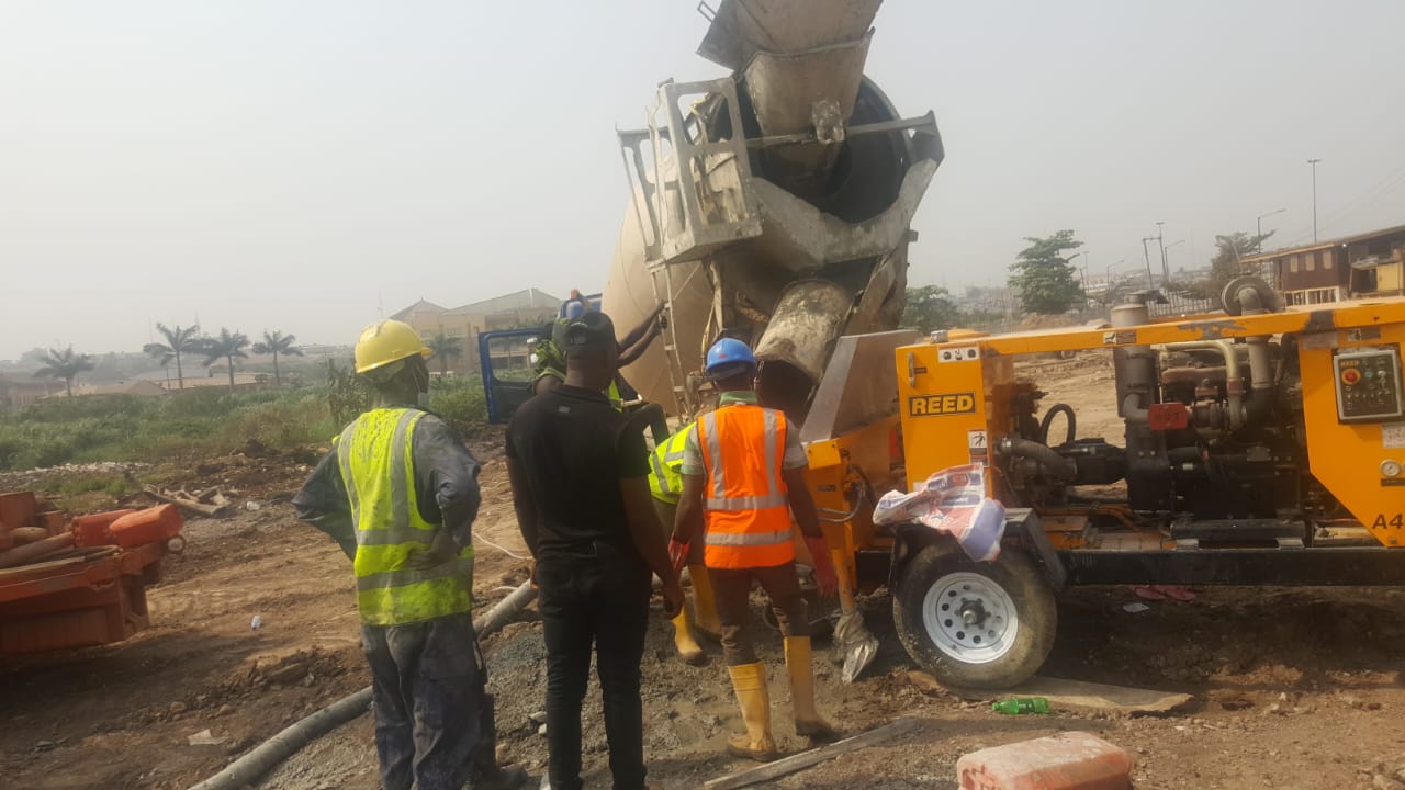 GTGABOD crew placing concrete with a REED pump fed by a mixer truck