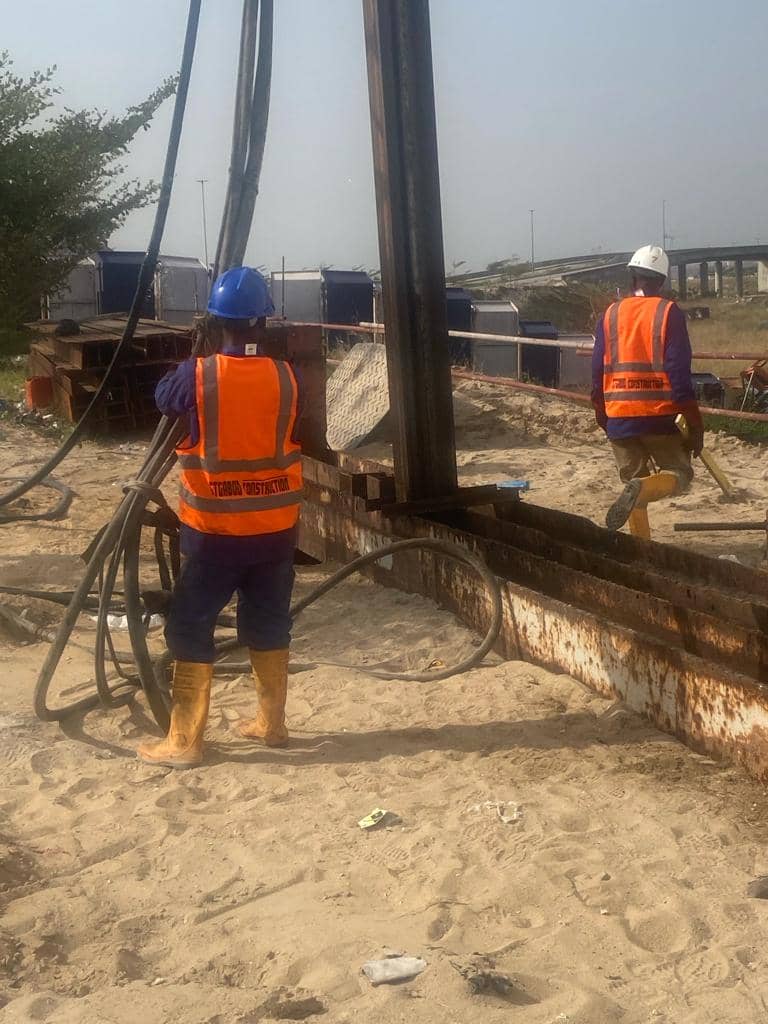 GTGABOD crew operating a driven-pile leader rig on a coastal Lagos site